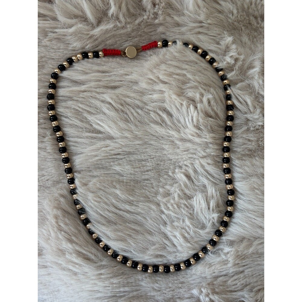 Roxanne Assoulin Black & Gold Beaded Necklace Gold Tone Macrame Slider NWOT